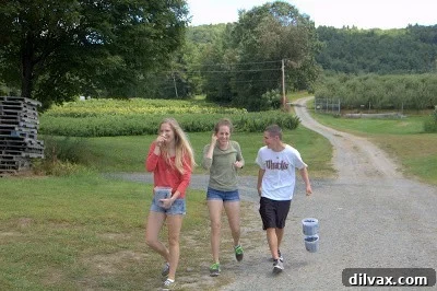 Happy children smiling and posing together at the farm
