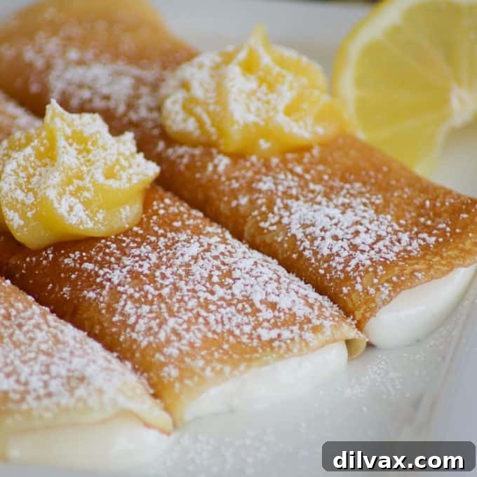 Lemon Crepes with a sweet, smooth filling with lemon curd on top, a delightful spring dessert.