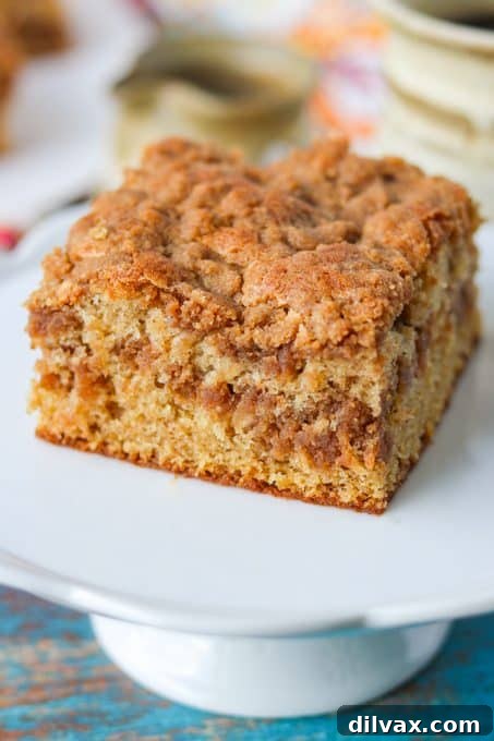 Classic Sour Cream Crumb Cake 8 Moist Coffee Cake made with sour cream and cinnamon streusel, ready to serve.