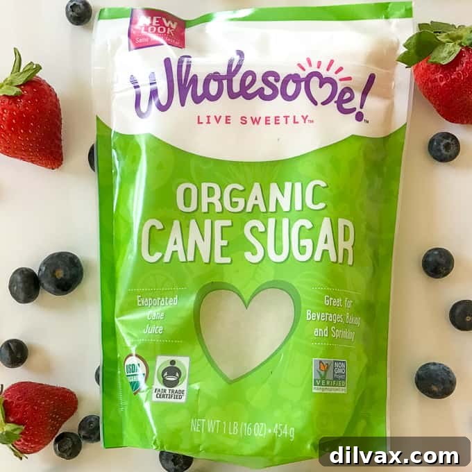 Wholesome Organic Cane Sugar and Fair Trade Certified Berries A bag of Wholesome Organic Cane Sugar next to a basket of fresh Fair Trade Certified berries.