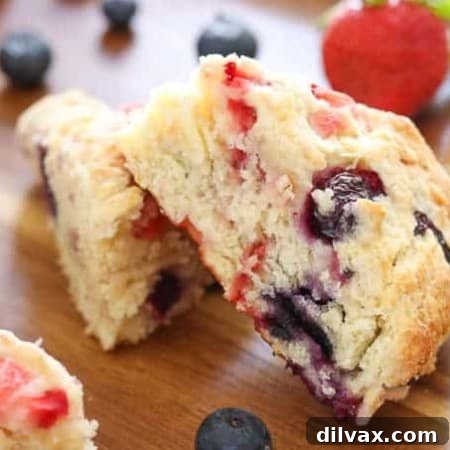 Summer Berry Scones 2 Delicious Mixed Berry Scones on a wooden tray made with Fair Trade Certified strawberries and blueberries.