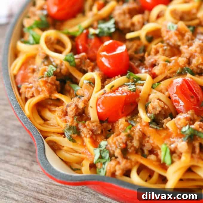 Quick & Easy One-Pot Sausage Linguine A steaming bowl of One-Pot Sausage Linguine, rich with pasta, savory sausage, tender cherry tomatoes, and fresh herbs, ready in under 30 minutes.