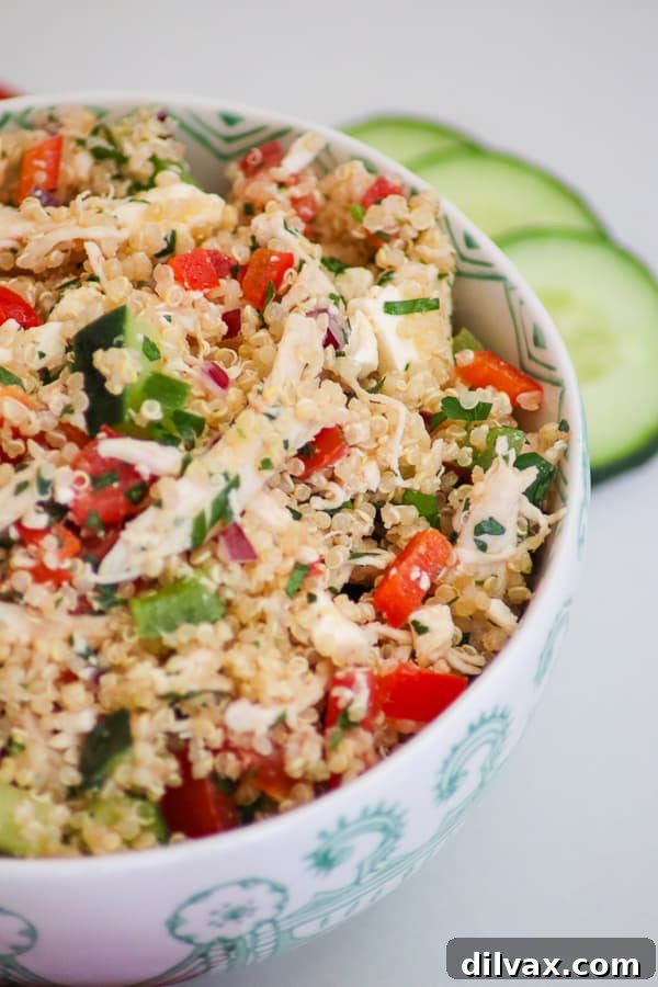 Greek Quinoa Chicken Salad: Fresh, Healthy, and Easy A vibrant Greek Quinoa Salad with shredded chicken, colorful vegetables, and crumbled feta cheese, all tossed in a light lemon vinaigrette. An ideal summer meal.