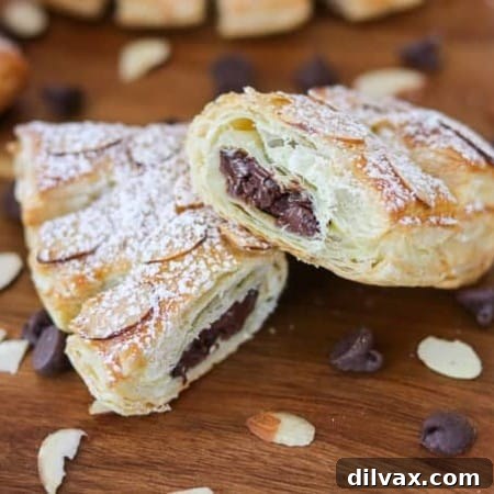Look at all the delicious chocolate inside these Chocolate Bear Claws! They're made with puff pastry, chocolate chips, almonds and sprinkled with powdered sugar.