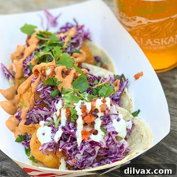 Three perfectly beer-battered halibut tacos, generously filled and garnished, from Deckhand Dave's in Juneau, Alaska.