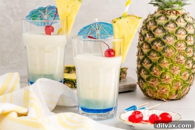 Azure Abyss Elixir 2 Vibrant Blue Ocean Cocktail, a refreshing tropical drink perfect for summer