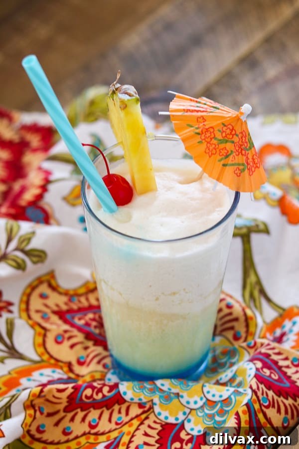 Azure Abyss Elixir 11 A frozen drink that will cool you off during the summer or transport you to the tropics in the winter - Blue Ocean Drink Recipe.