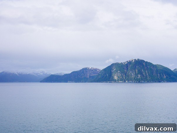 Azure Abyss Elixir 12 Majestic mountains and pristine waters during an Alaska cruise, inspiring tropical dreams