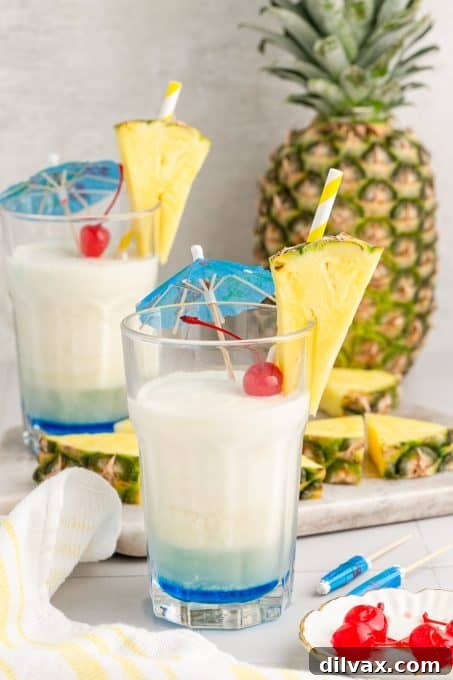 Azure Abyss Elixir 8 Ingredients for a Blue Ocean Cocktail including pineapple, coconut, rum, and Blue Curaçao