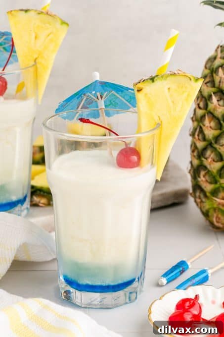 Azure Abyss Elixir 9 An icy, vibrant Caribbean cocktail, perfect for cooling off