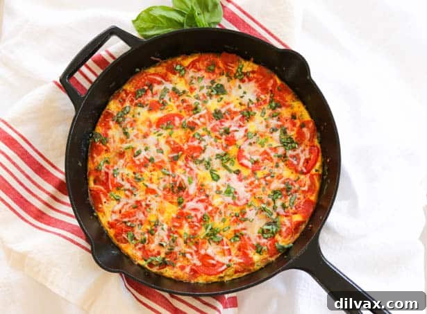 Meat Lover's Pizza Frittata in skillet. Meat Lover's Pizza Frittata in skillet, ready to serve.
