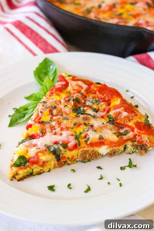 Slice of Meat Lover's Pizza Frittata. Slice of Meat Lover's Pizza Frittata on a plate.