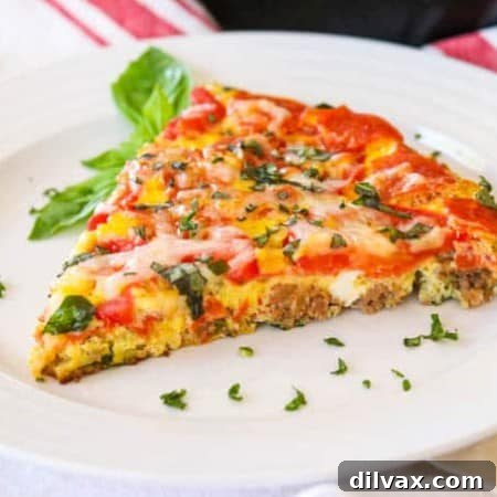 Carnivore's Pizza Frittata 2 Slice of Meat Lover's Pizza Frittata on a plate, ready to be enjoyed.