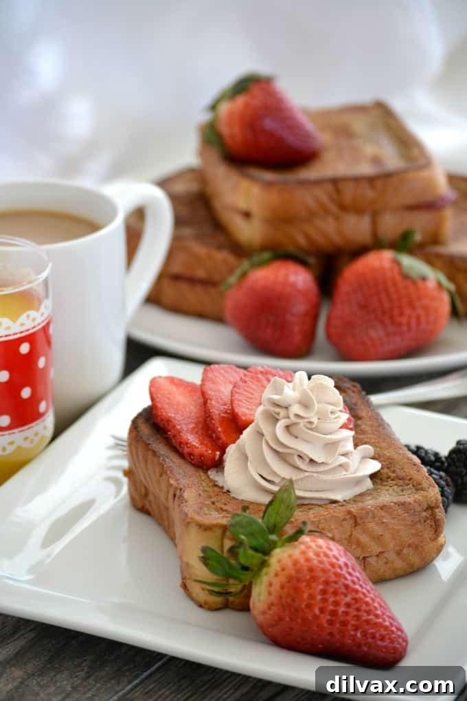 Strawberry Stuffed Mocha French Toast made with Texas toast, cream cheese, and strawberries, dipped in a rich mocha batter.