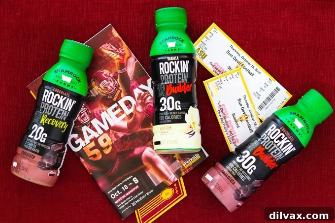 Shamrock Farms Rockin' Protein bottles displayed with ASU football program and game tickets, highlighting its role as the official protein and milk beverage of Arizona State University athletics.