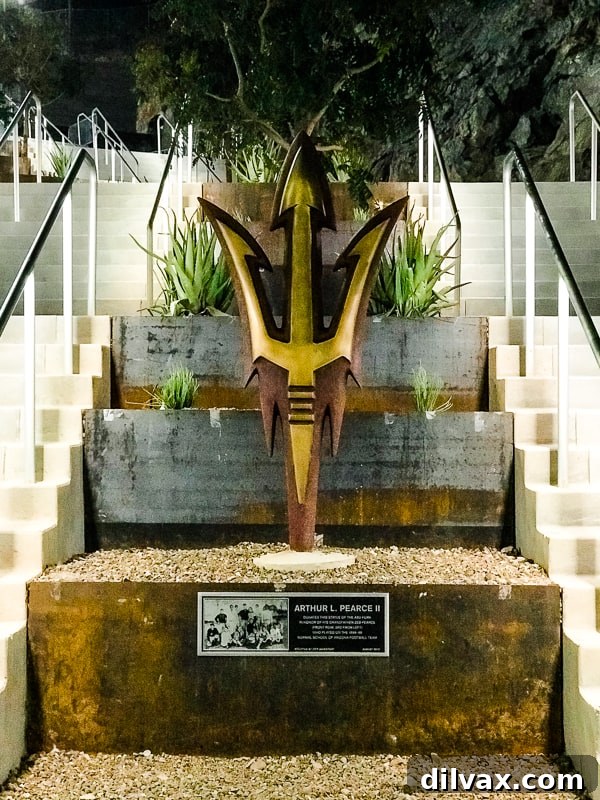 The iconic ASU Pitchfork sculpture standing proudly at Sun Devil Stadium, symbolizing Arizona State University's spirit.