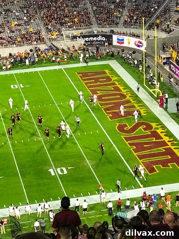 ASU Sun Devils football team competing against the Stanford Cardinals during an exciting game at Sun Devil Stadium.