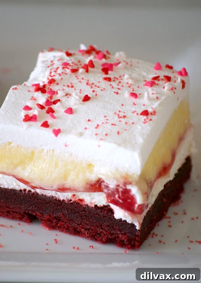 These Red Velvet Cherry Dream Bars with their red velvet cookie crust, sweet cheese layer, cherry pie filling, vanilla pudding and whipped topping make these bars the perfect holiday treat. Or better yet, enjoy them all year 'round.