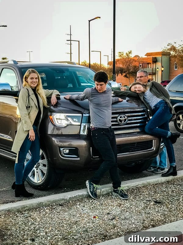 Furry Friend Friday Family 11 Our family gathered proudly at the hood of the impressive 2019 Toyota Sequoia Platinum, marking a memorable holiday together.