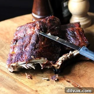 Delicious Dry Rubbed Smoked Back Ribs on a plate with corn