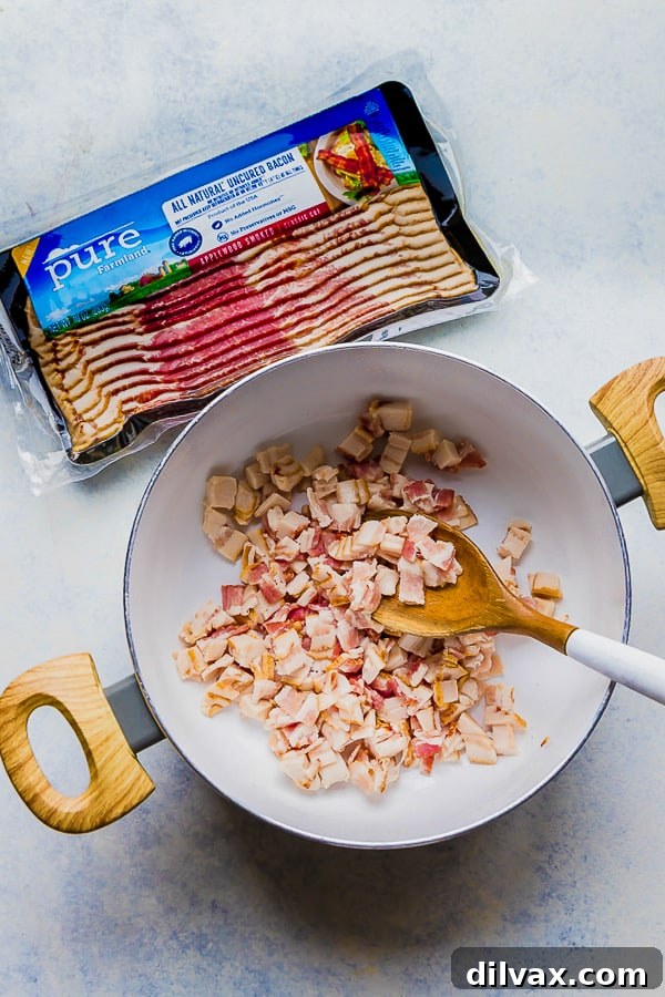 Pure Farmland Bacon cooking for One Pot Bacon and Tortellini Zuppa Toscana. Pure Farmland Bacon cooking in a pan, sizzling and becoming crispy for the Zuppa Toscana.