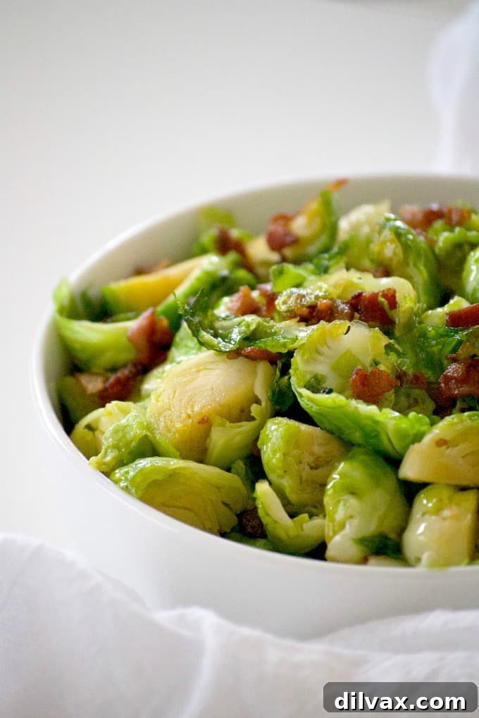 Sweet and Salty Bacon Caramel Apple Crisp 14 Maple Bacon Brussels Sprouts cooked in a skillet, a delicious side dish for any meal.