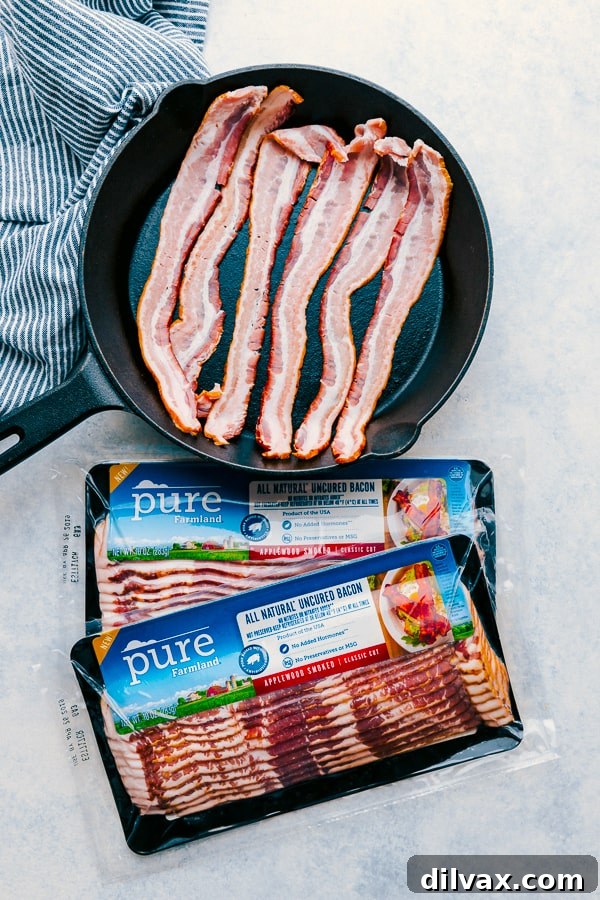 Sweet and Salty Bacon Caramel Apple Crisp 3 Pure Farmland Bacon cooking in a skillet, essential for Bacon Caramel Apple Crisp.