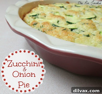 Delicious golden brown Zucchini and Onion Pie from The Pin Junkie, freshly baked
