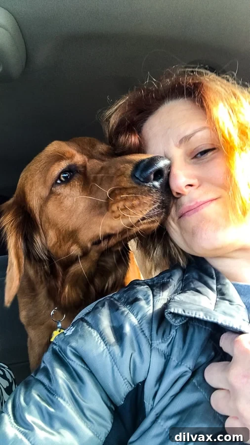 Pawsome Mothers Day Friday 9 Logan the Golden Dog lovingly gives a kiss to Lynne of 365 Days of Baking, showing their strong bond.