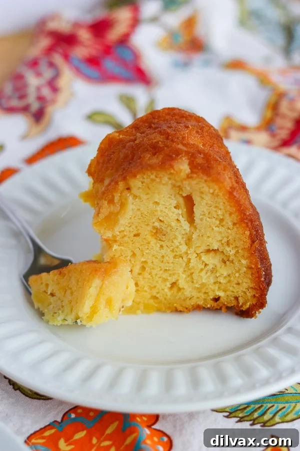 A bite of Pineapple Rum Cake. A bite of Pineapple Rum Cake.