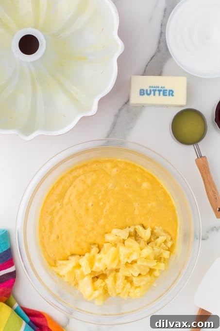 Close-up of the smooth, golden batter for the pineapple and rum cake.