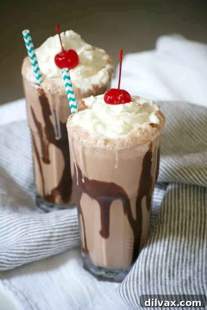 A rich and creamy Double Chocolate Malted Milkshake, a decadent sweet treat to cool down.