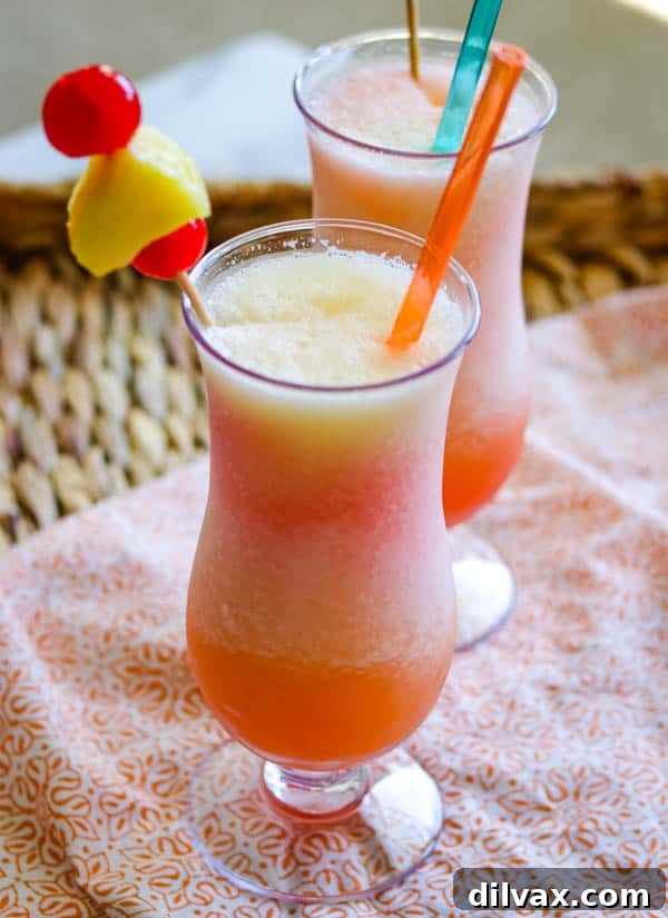 A Frozen Bahama Mama with fresh pineapple and cherries. A Frozen Bahama Mama cocktail, beautifully garnished with fresh pineapple and cherries, embodying the spirit of a tropical escape.
