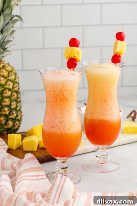 Paradise Blend 3 A single frozen Bahama Mama in a tall glass, with a lush green tropical plant in the background, emphasizing its refreshing appeal.