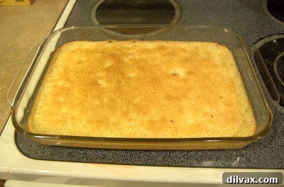 Baked lemon squares in the pan, fresh from the oven.