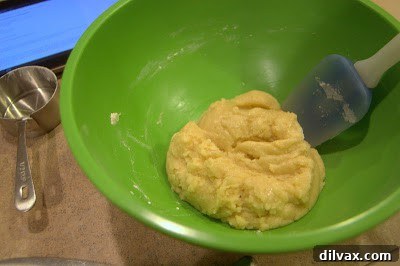 Pressing the crust mixture into a baking pan.