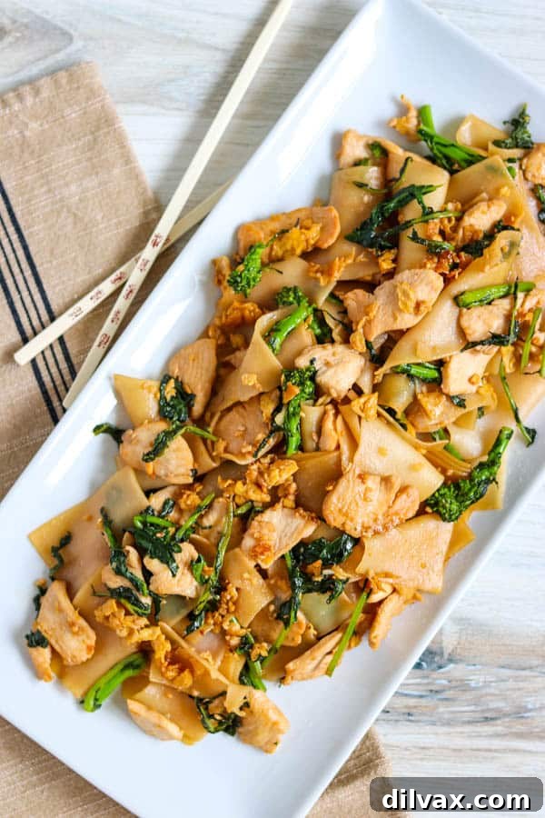 A serving of Pad See Ew, showcasing the noodles and vegetables.