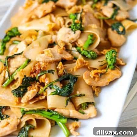 Pad See Ew with chopsticks.