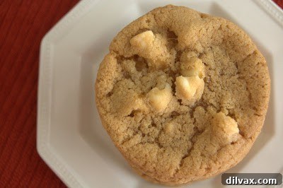 A plate of freshly baked white chocolate choco chip cookies, ready to be enjoyed.