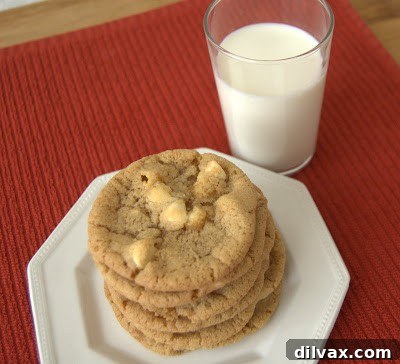 Close-up of butter and sugars being creamed together in a stand mixer, creating a light and fluffy mixture.
