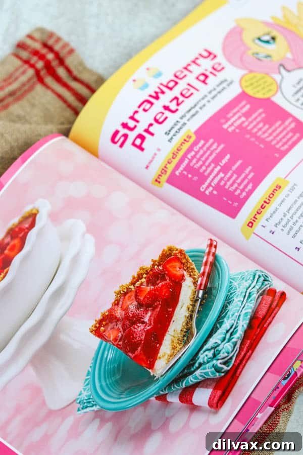 A close-up photograph of the Strawberry Pretzel Pie from the My Little Pony Baking Book, highlighting its enticing layers.