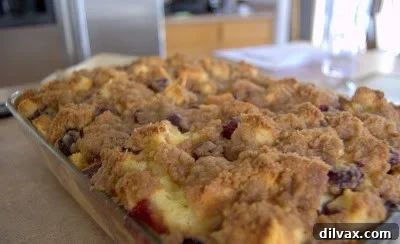 A closer shot of the golden-brown Blueberry French Toast Bake, showcasing its enticing streusel topping and juicy blueberries.