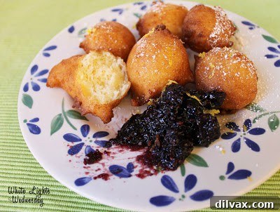 Light and fluffy Lemon Ricotta Fritters with blackberry preserves