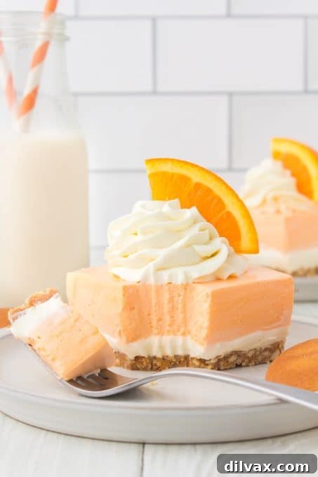 Orange Cloud Nine Bars 3 No Bake Orange Creamsicle Dream Bars displaying their distinct orange and white layers