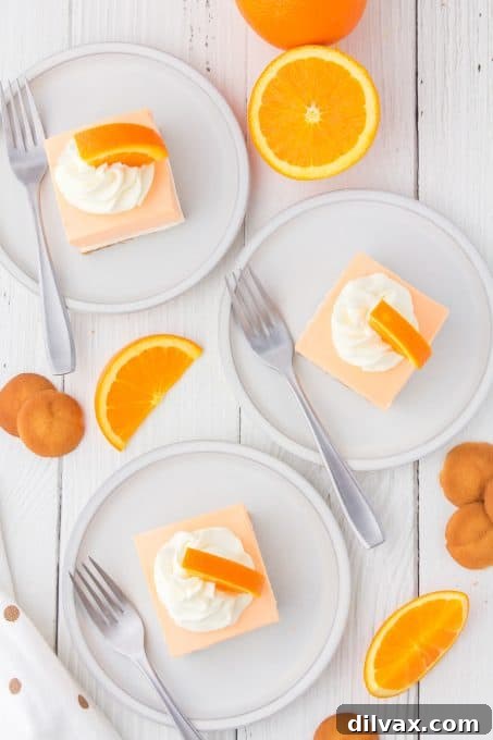 Orange Cloud Nine Bars 10 Perfectly sliced Orange Creamsicle Dream Bars on a serving platter