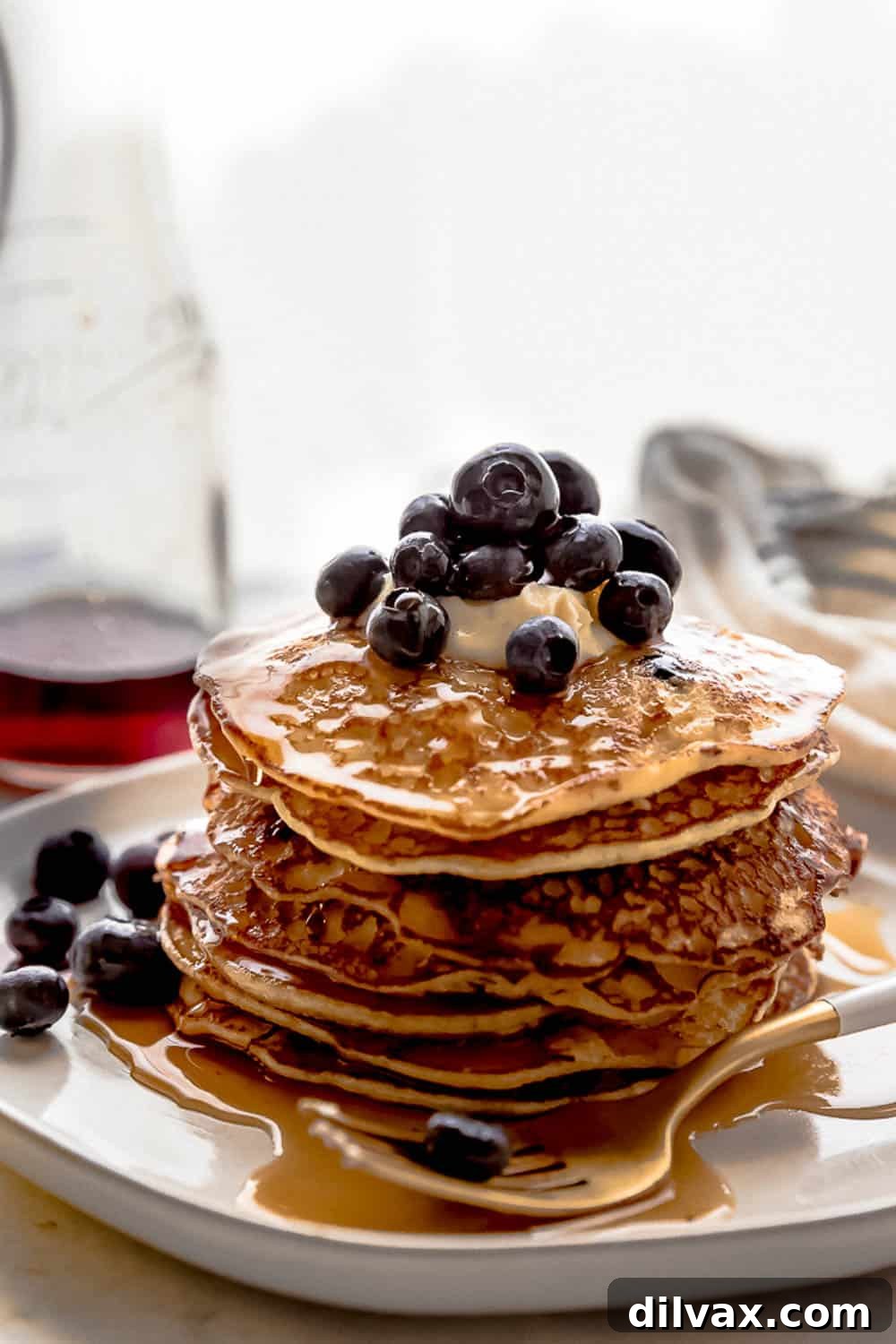 Close-up of Cottage Cheese Pancakes A close-up shot of Lemon Blueberry Cottage Cheese Pancakes, revealing the individual blueberries nestled within the fluffy pancake, ready to be enjoyed.