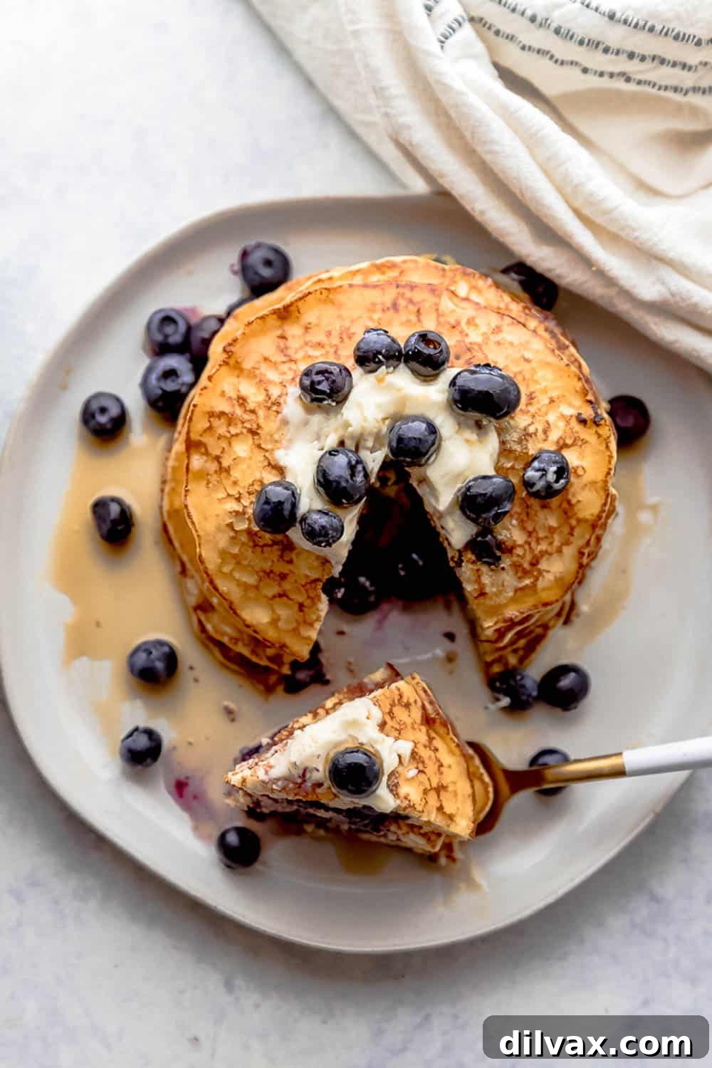 Fluffy Lemon Blueberry Cottage Cheese Pancakes A beautifully presented stack of fluffy Lemon Blueberry Cottage Cheese Pancakes, garnished with fresh blueberries and a drizzle of maple syrup, perfect for a wholesome breakfast.