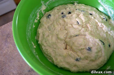 Pancakes being flipped on a griddle