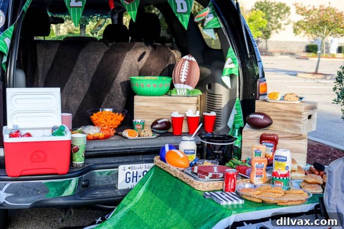 A vibrant tailgate party spread featuring Slow Cooker Buffalo Chicken Dip.