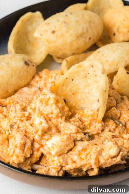 Close-up of Slow Cooker Buffalo Chicken Dip in a crockpot.